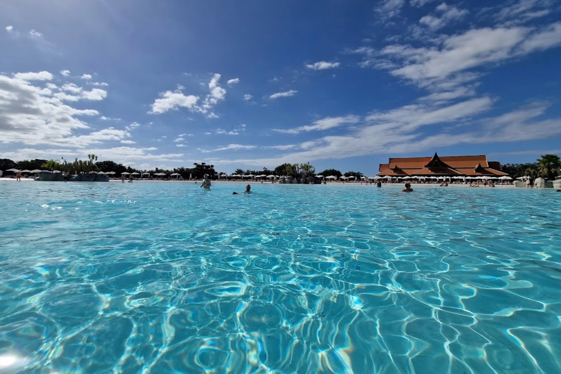 Crystal-clear water pool at Siam Park, Tenerife, offering a refreshing oasis for visitors to relax and enjoy