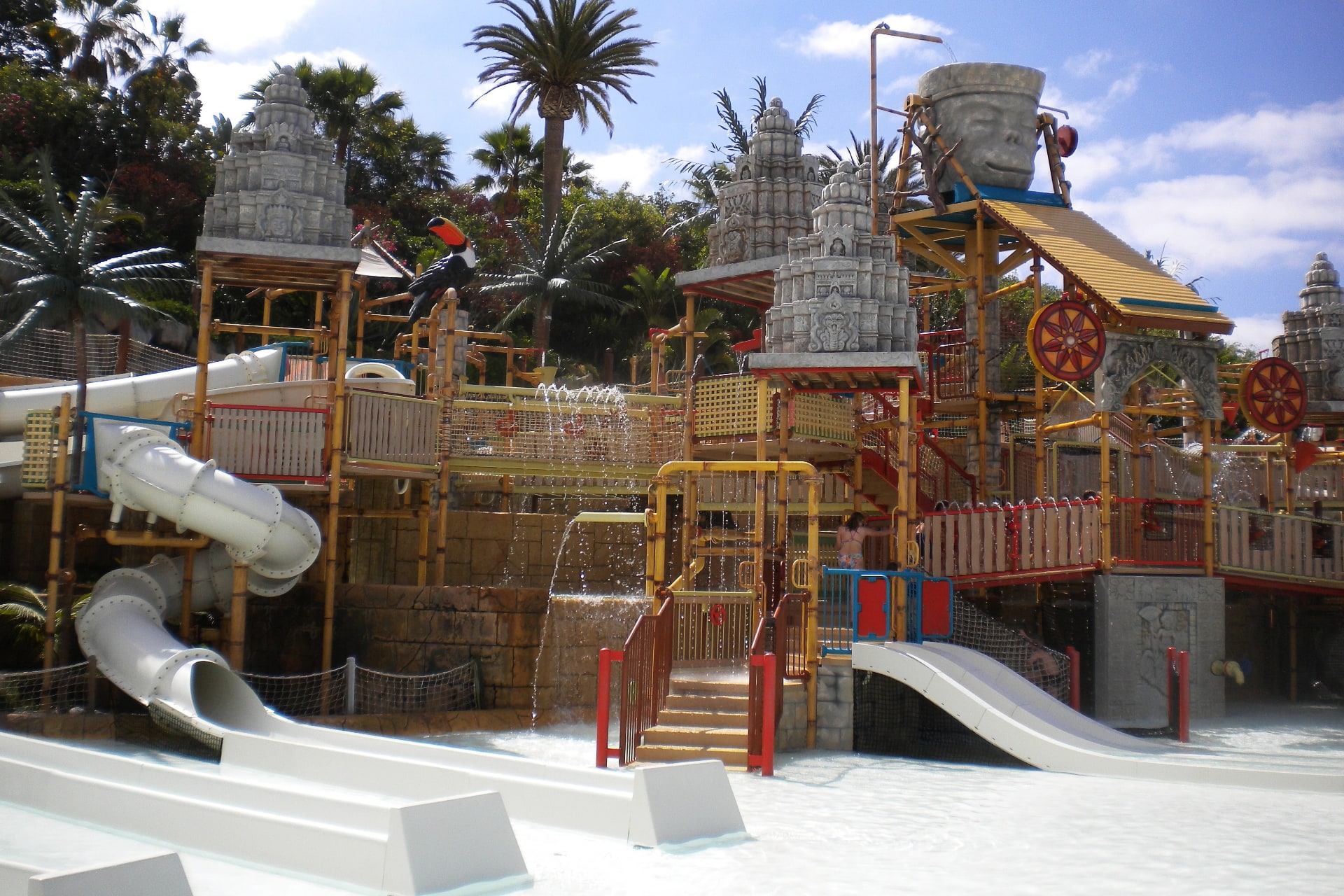 View of the Lost City attraction at Siam Park, Tenerife, with multiple water slides and pools
